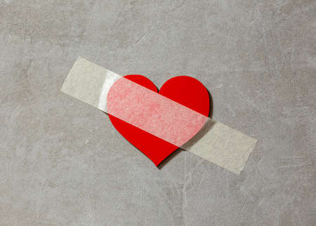 broken heart sealed with duct tapeの写真素材