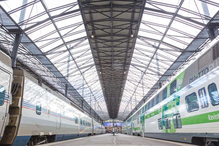 allegro international train and domestic vr train stand on the platform of Helsinki Central Station