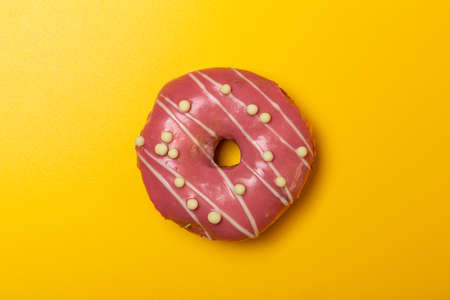 strawberry plum donut on yellow backgroundの写真素材