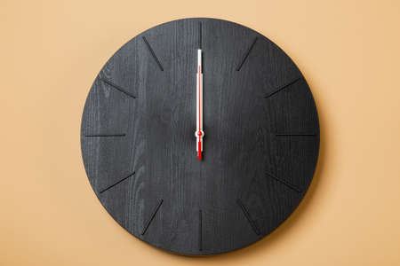 minimalist wall clocks shows twelve o'clock