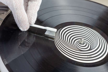 removing dust from the vinyl recordの写真素材