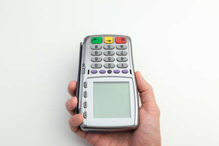 the waiter holds out a mobile bank terminalの写真素材