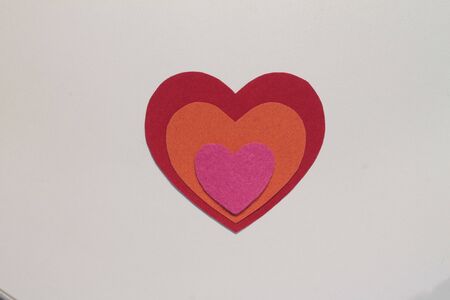 Colored hearts lie on a white background. Copy space.の写真素材