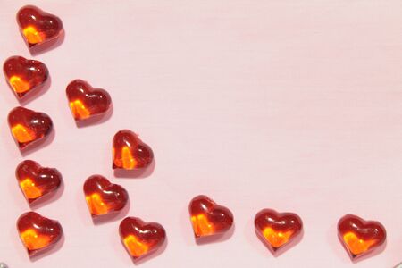 Glass hearts on a pink background. Valentines day. Place for text.の写真素材