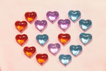 Glass hearts on a pink background. Valentines day.の写真素材