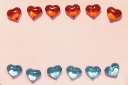 Glass hearts on a pink background. Valentines day. Place for text.の写真素材