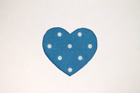 Blue heart shaped slot in craft paper.の写真素材