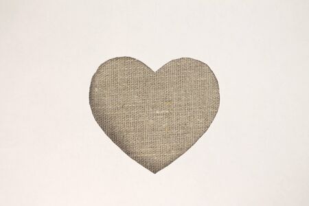 Gray heart shaped slot in craft paper.の写真素材