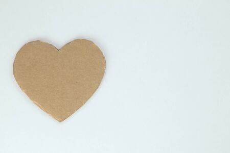 Cardboard heart on the background.