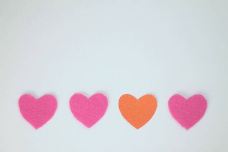 Colored hearts lie on a pink background. Copy space.の写真素材