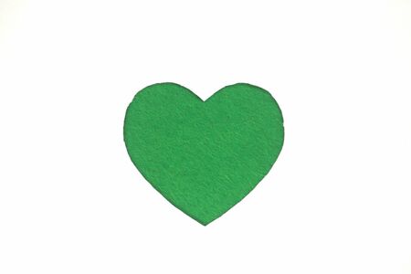 Green heart shaped slot in craft paper.の写真素材