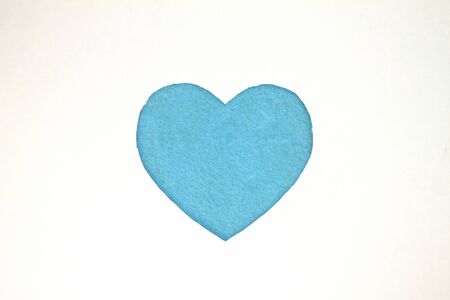 Blue heart shaped slot in craft paper.の写真素材