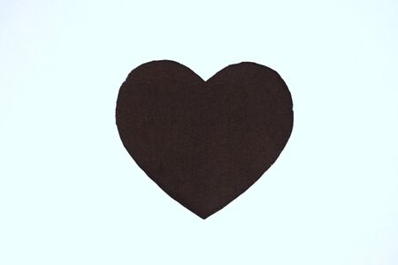 Black heart shaped slot in craft paper.の写真素材