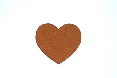 Brown heart shaped slot in craft paper.の写真素材