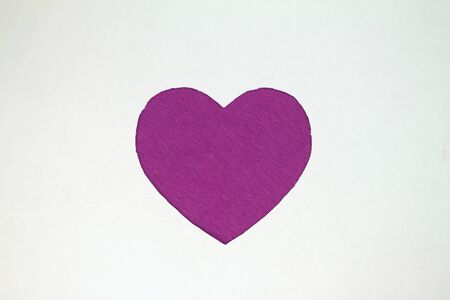 Violet heart shaped slot in craft paper.の写真素材