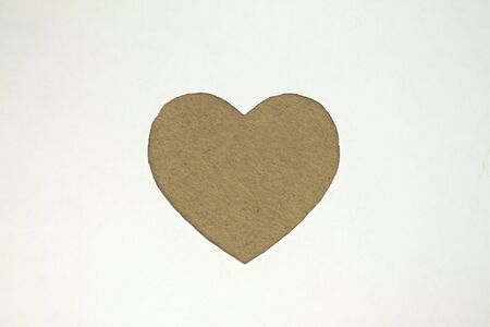 Green heart shaped slot in craft paper.の写真素材