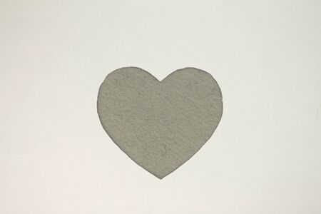 Gray heart shaped slot in craft paper.の写真素材