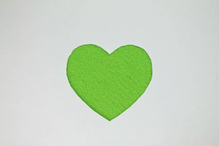 Green heart shaped slot in craft paper.の写真素材
