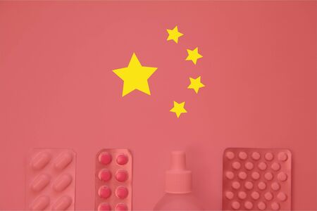 Chinese flag on background of pills and thermometer. Global healthcare concept.の写真素材