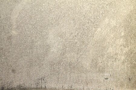 Blue window glass covered hoarfrost ice pattern texture. Cold nature winter background.の写真素材
