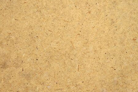 Yellow wood fiber construction panel surface texture.の写真素材
