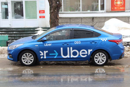 02.02.2020 Syktyvkar, Russia, Uber car on russian street background. Stock photo with empty space...