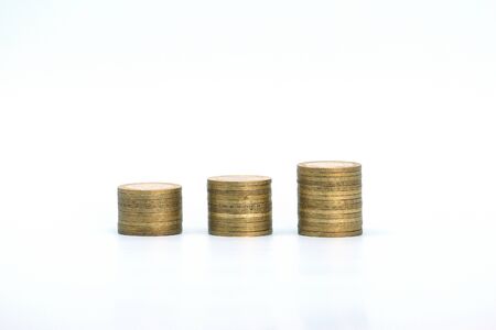 Piles of golden metallic coins. Columns of coins of different heights. The concept of business,...