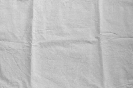 White gray linen fabric cotton for wallpaper design. Weave cotton background texture.の写真素材