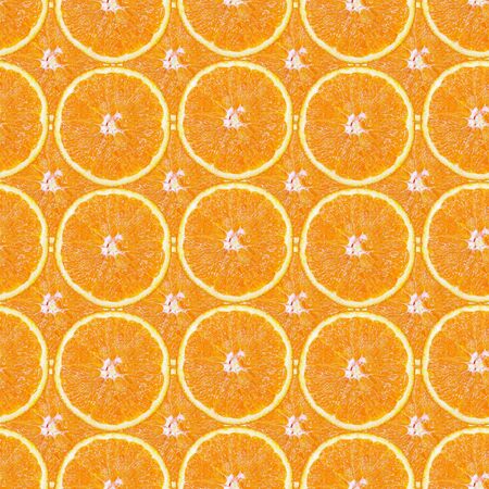 Seamless pattern of juicy slices of orange in the form of tiles. Design for packaging and backgrounds.の写真素材