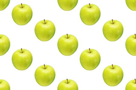 Pattern of green apples on a white background. Isolated fruits. Image for fabric, wallpaper and wrapping paper.の写真素材