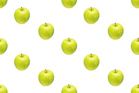 Pattern of green apples on a white background. Isolated fruits. Image for fabric, wallpaper and wrapping paper.の写真素材