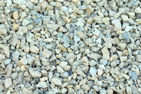 Background of blue and gray gravel. Small stones lie on the ground at a construction site. Pebble pattern on the beach.の写真素材