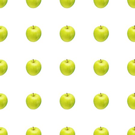 Pattern of green apples on a white background. Isolated fruits. Image for fabric, wallpaper and wrapping paper.の写真素材