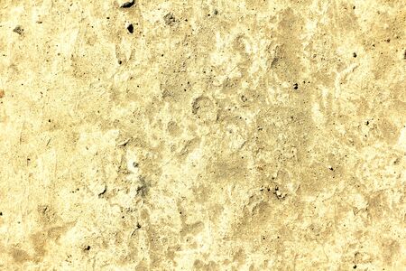 The texture of the old cloved concrete. The surface of the limestone stone. Place for text, background for design.の写真素材