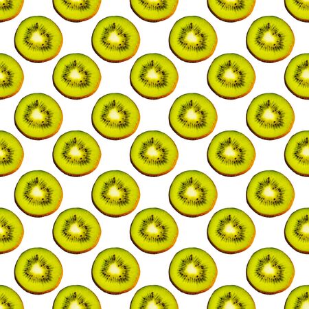 Seamless endless pattern of juicy green slices of kiwi fruit isolated on white background. Design for wrapping paper, fabric and wallpaper.の写真素材
