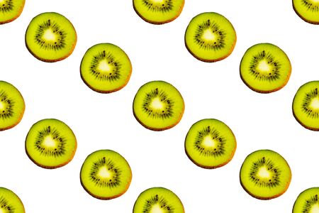 Seamless endless pattern of juicy green slices of kiwi fruit isolated on white background. Design for wrapping paper, fabric and wallpaper.の写真素材