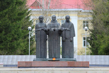 17-05-2020. Syktyvkar, Russia. Eternal flame memorial in Syktyvkar, Russia. Monument to the soldiers who fell in the second world war, in the great patriotic war. Sculptures of three women with a memorial wreath. Burning flame bright orange color.のeditorial素材