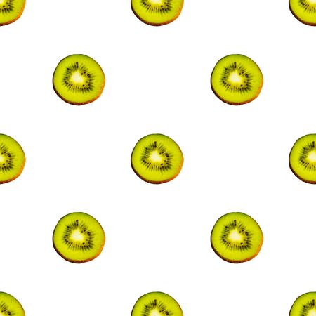 Seamless endless pattern of juicy green slices of kiwi fruit isolated on white background. Design for wrapping paper, fabric and wallpaper.の写真素材
