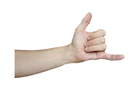 Male hand with fair skin shows a gesture, hand on a white isolation background. The thumb and little finger are open, the rest of the fingers are bent, a sign of greeting, gratitude, goodbye. Stock photo for web and print.の写真素材
