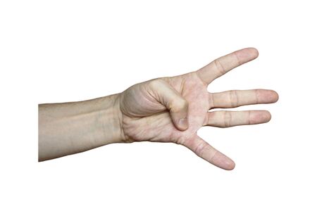 Male hand with fair skin shows a gesture, hand on a white isolation background. Four fingers extended, thumb pressed to the palm, four sign Stock photo for web and print.の写真素材