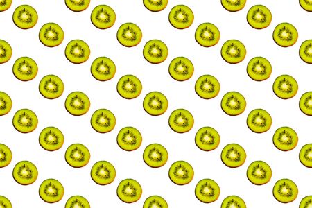 Seamless endless pattern of juicy green slices of kiwi fruit isolated on white background. Design for wrapping paper, fabric and wallpaper.の写真素材