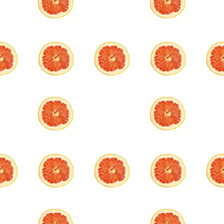 Seamless infinity pattern of isolated slices of grapefruit. Wallpaper for background, design and packaging.の写真素材