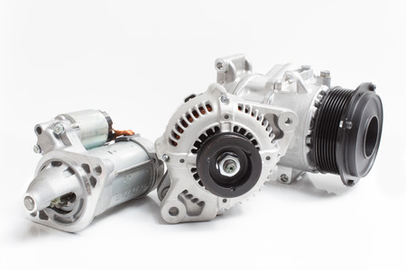 Generator, air conditioning compressor and the starter on a white backgroundの写真素材