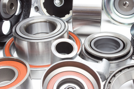 located on a white background variety of bearings and rollers wide range of applications, from automotive hub to engine belt tensionersの写真素材