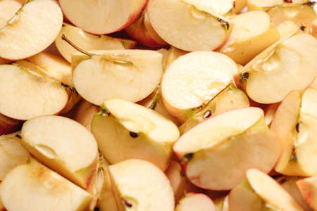 Sliced apples fruit. Close-up of many slices of cut applesの写真素材