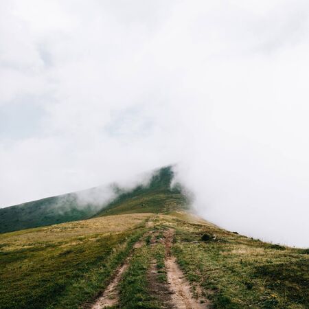 Foggy trail somewhere in the clouds. Carpathian mountains, Ukraineの写真素材