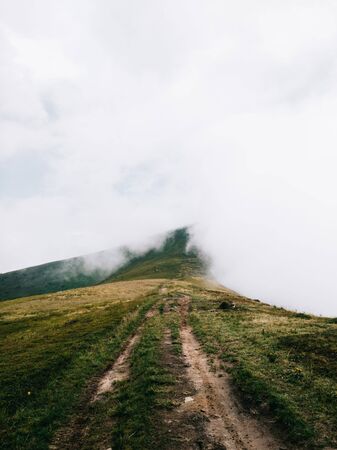 Foggy trail somewhere in the clouds. Carpathian mountains, Ukraineの写真素材