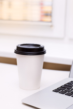 paper coffee cup on the tableの写真素材