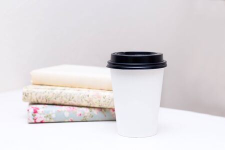 stack of books and paper cupの写真素材