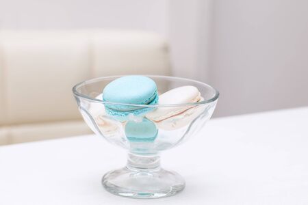 macaroons lies in a glass vase for sweetsの写真素材